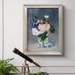 Impressionist floral still life painting by Claude Monet in an ornate champagne frame displayed in a light-toned interior setting.