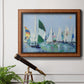 Coastal harbor watercolor painting in an ornate vintage burl wood frame displayed in a light-toned interior setting.