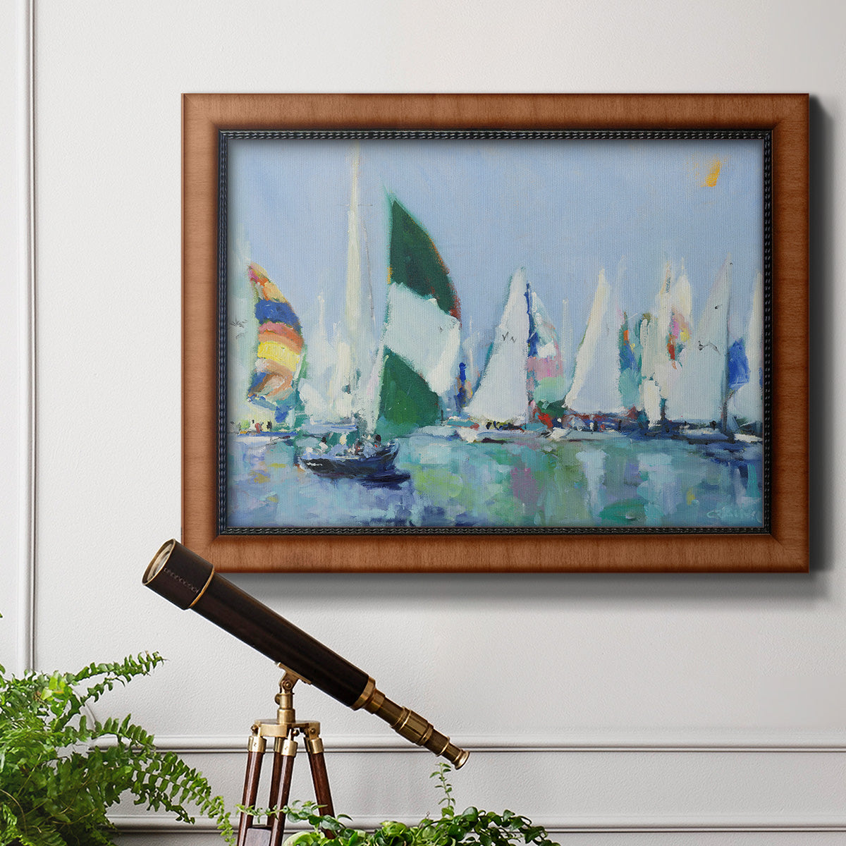 Coastal harbor watercolor painting in an ornate vintage burl wood frame displayed in a light-toned interior setting.