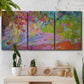Three-panel canvas wall art featuring vibrant abstract with dramatic motion, displayed in a boho-chic entryway above a console table.