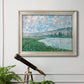 Impressionist river landscape at Vétheuil by Claude Monet in an ornate champagne frame displayed in a light-toned interior setting.