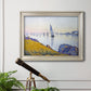 Impressionist coastal harbor at dusk by Paul Signac in an ornate champagne frame displayed in a light-toned interior setting.