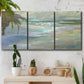 Three-panel canvas wall art featuring soft coastal beach light landscape, displayed in a boho-chic entryway above a console table.