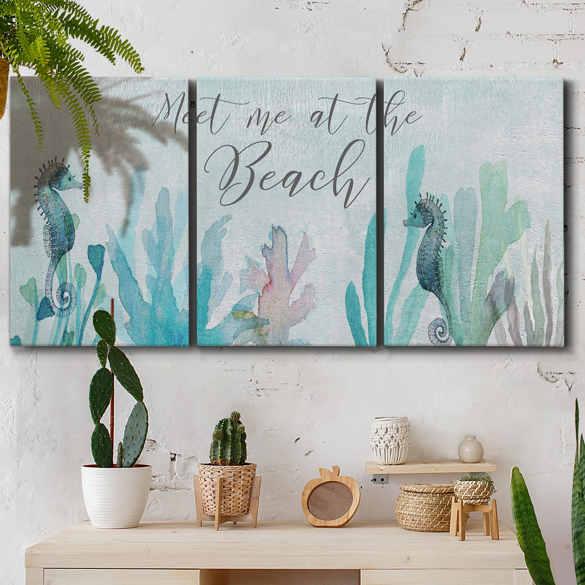 Three-panel canvas wall art featuring coastal typography with seahorses, displayed in a boho-chic entryway above a console table.
