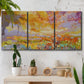 Three-panel canvas wall art featuring abstract meadow inspired color fields, displayed in a boho-chic entryway above a console table.