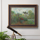 Impressionist garden landscape at Argenteuil by Claude Monet in an ornate bronzed mahogany wood frame displayed in a light-toned interior setting.