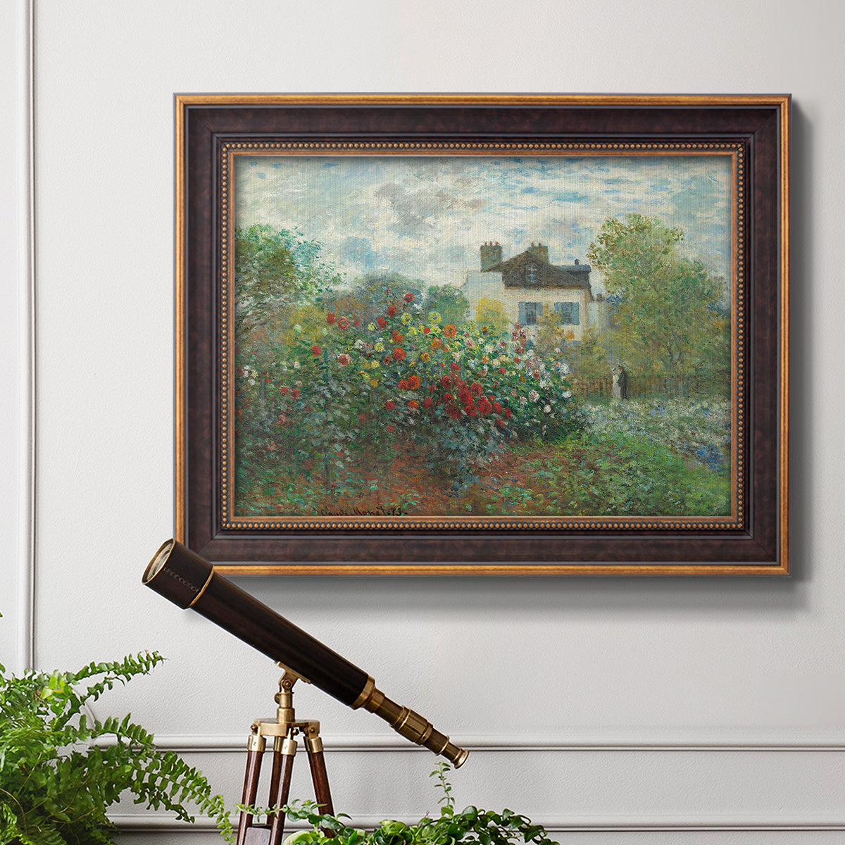 Impressionist garden landscape at Argenteuil by Claude Monet in an ornate bronzed mahogany wood frame displayed in a light-toned interior setting.