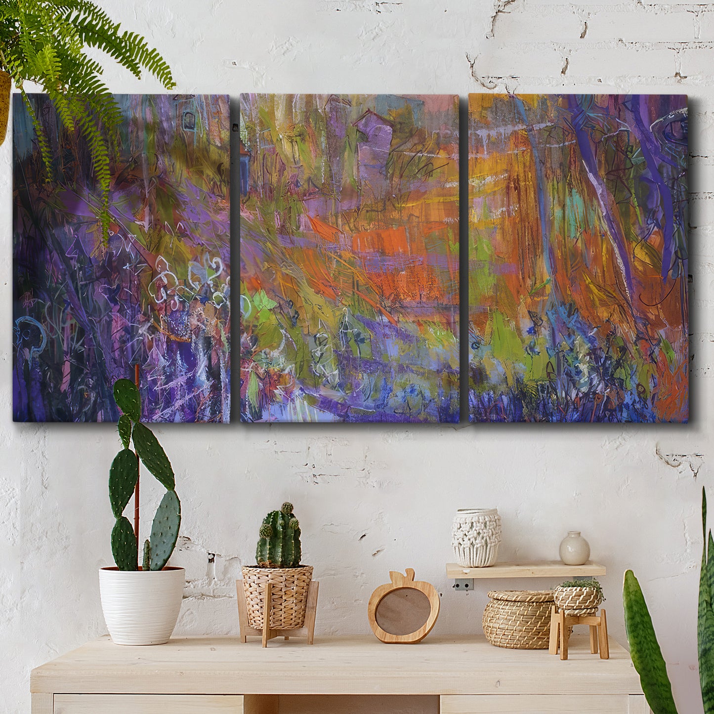 Three-panel canvas wall art featuring abstract rainfall with butterfly forms, displayed in a boho-chic entryway above a console table.