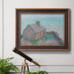 Impressionist coastal building landscape by Claude Monet in an ornate bronzed mahogany wood frame displayed in a light-toned interior setting.