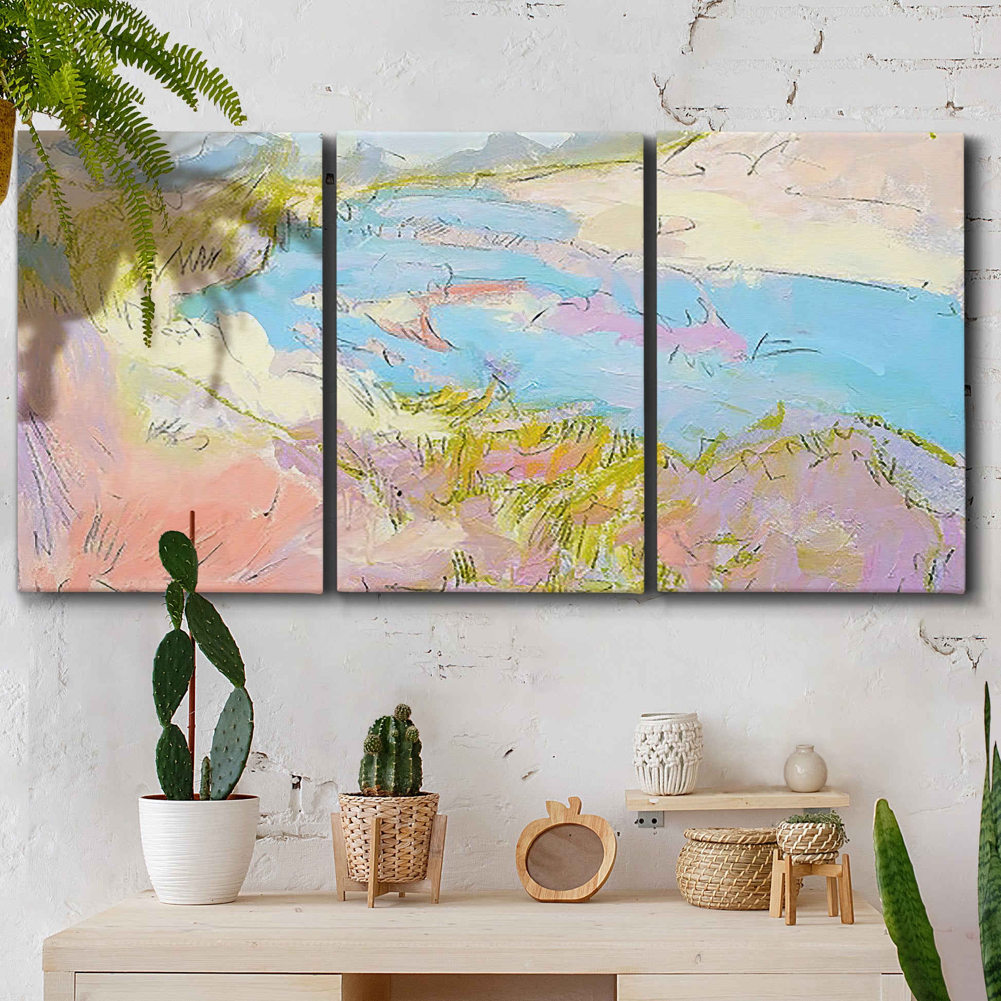 Three-panel canvas wall art featuring geometric mid century abstract blocks, displayed in a boho-chic entryway above a console table.