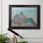 Impressionist coastal building landscape by Claude Monet in an ornate black frame with gilded inner detail displayed in a light-toned interior setting.