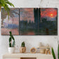 Three-panel canvas wall art featuring parliament silhouetted at dusk, displayed in a boho-chic entryway above a console table.