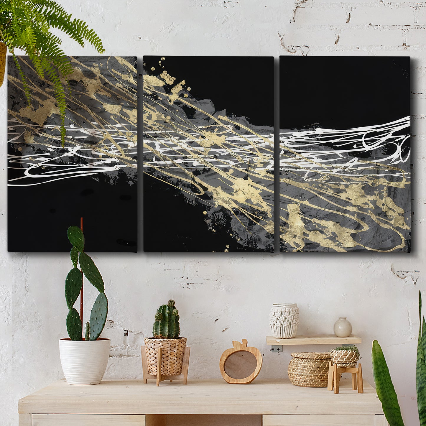 Three-panel canvas wall art featuring dark modern abstract wind patterns, displayed in a boho-chic entryway above a console table.