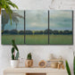 Three-panel canvas wall art featuring rolling green pastoral fields, displayed in a boho-chic entryway above a console table.
