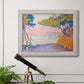 Pointillist coastal seascape by Paul Signac in an ornate weathered white frame displayed in a light-toned interior setting.