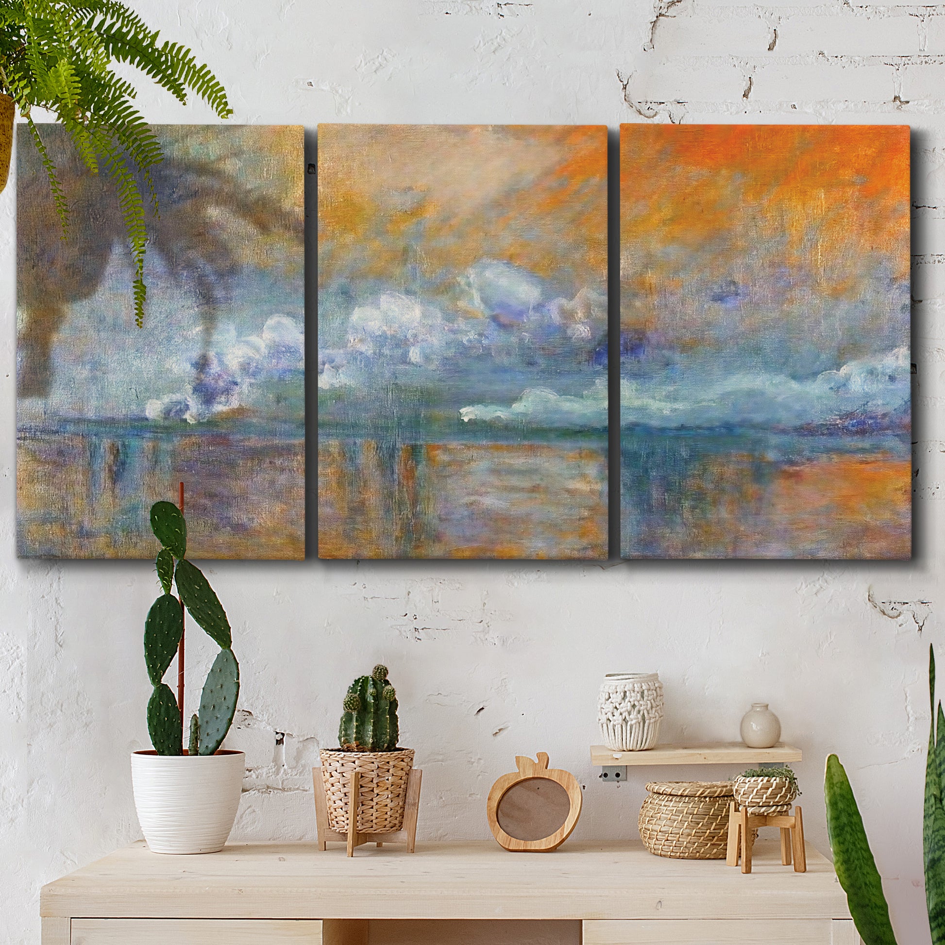 Three-panel canvas wall art featuring bridge shrouded in fog and smoke, displayed in a boho-chic entryway above a console table.