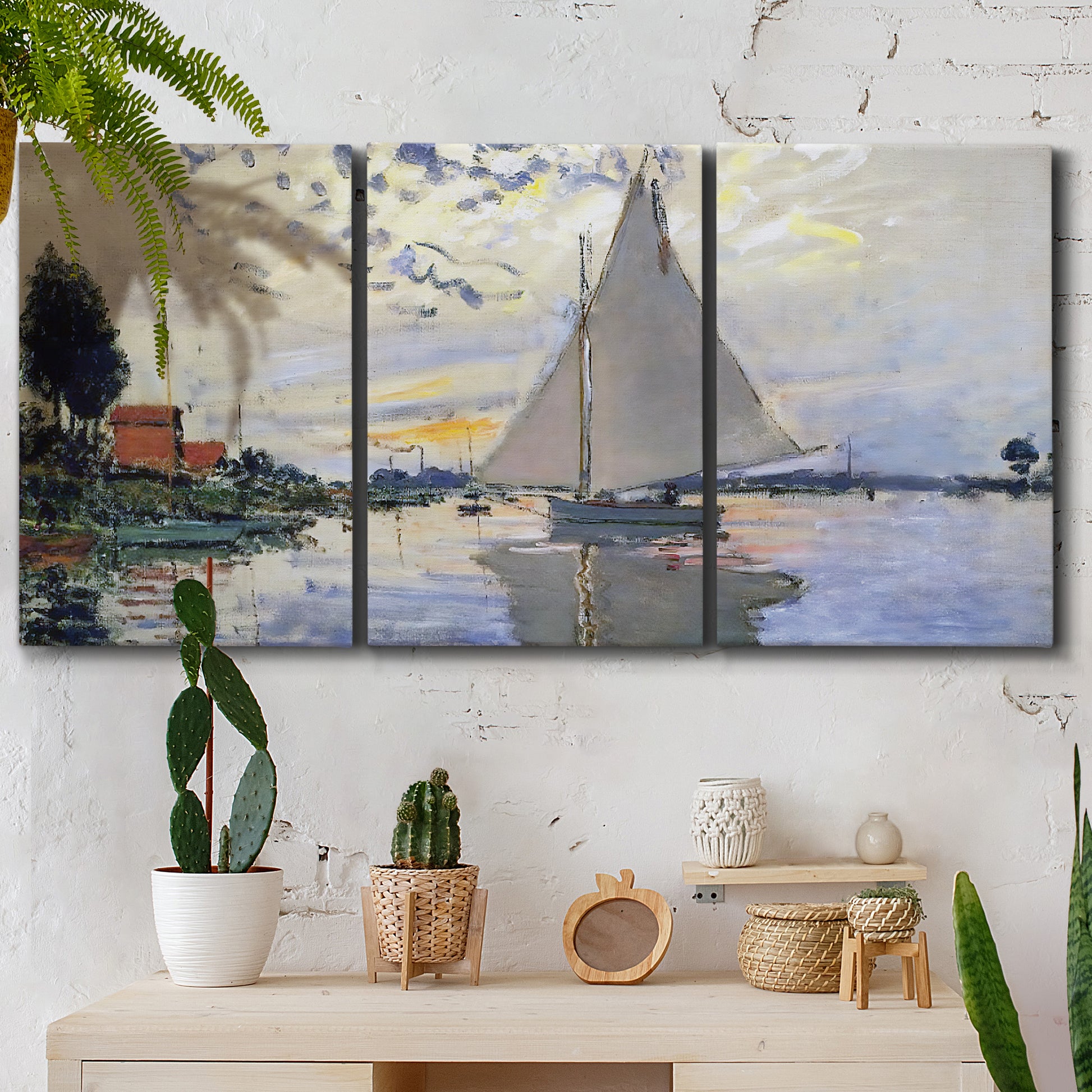 Three-panel canvas wall art featuring riverside village shoreline, displayed in a boho-chic entryway above a console table.