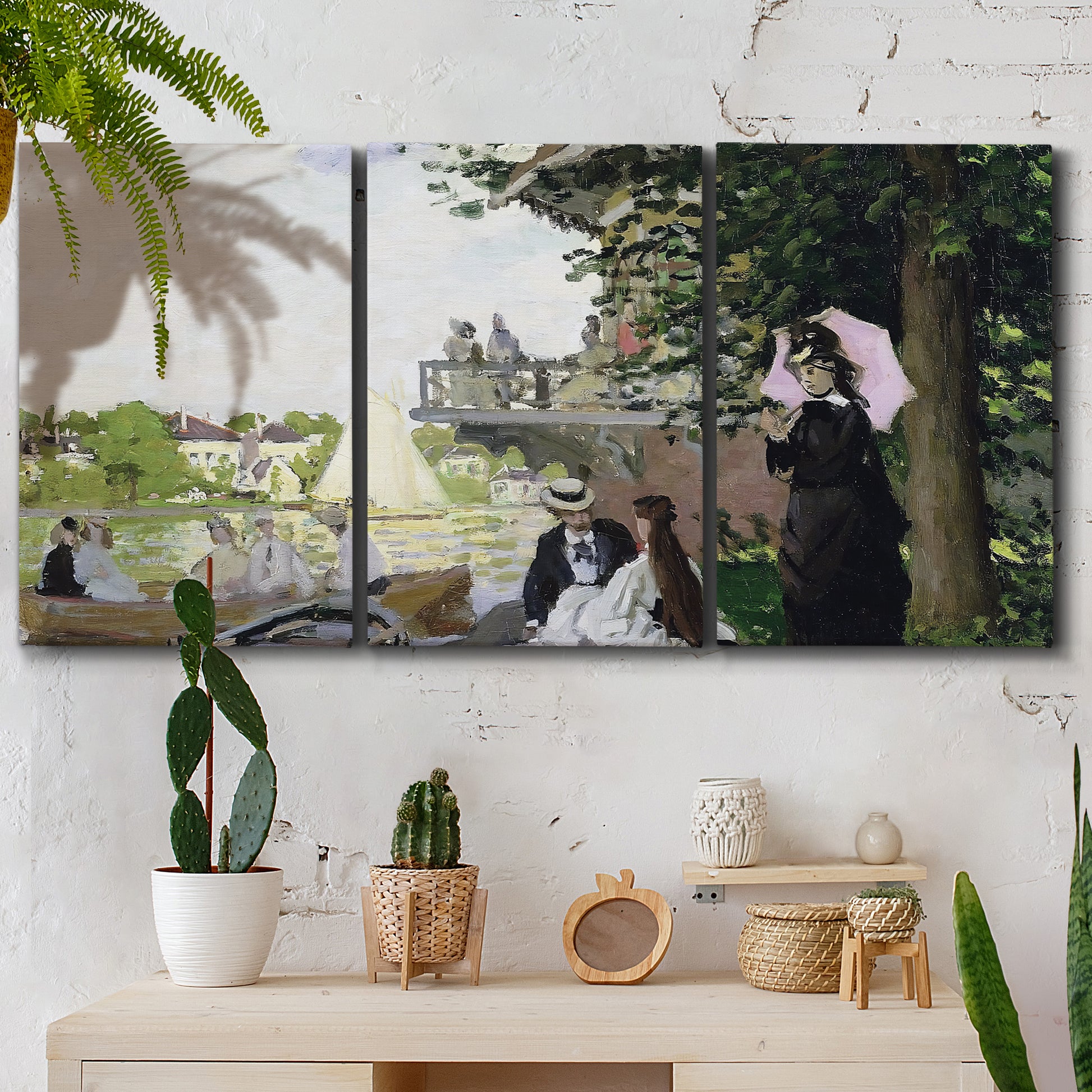 Three-panel canvas wall art featuring garden house beside river, displayed in a boho-chic entryway above a console table.