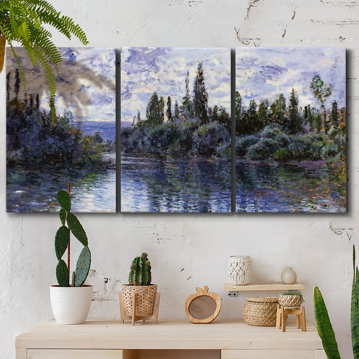 Three-panel canvas wall art featuring quiet river bend near village, displayed in a boho-chic entryway above a console table.