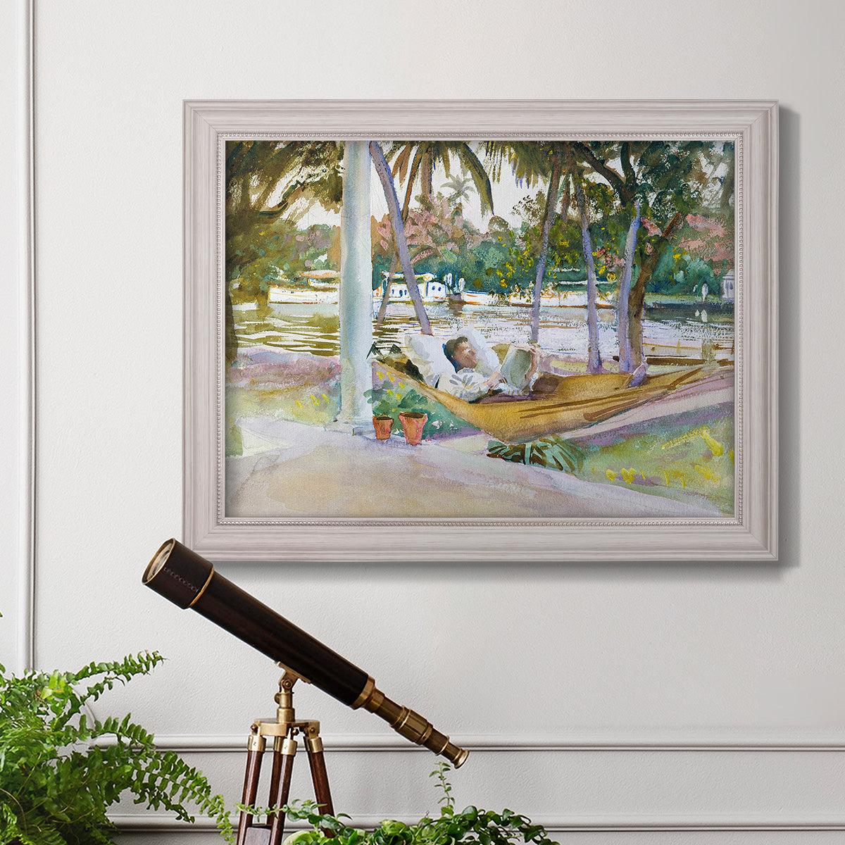 Impressionist leisure portrait scene by John Singer Sargent in an ornate weathered white frame displayed in a light-toned interior setting.