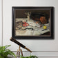 Impressionist still life painting of fish by Édouard Manet in an ornate black frame with gilded inner detail displayed in a light-toned interior setting.