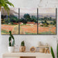 Three-panel canvas wall art featuring haystacks arranged in rural field, displayed in a boho-chic entryway above a console table.
