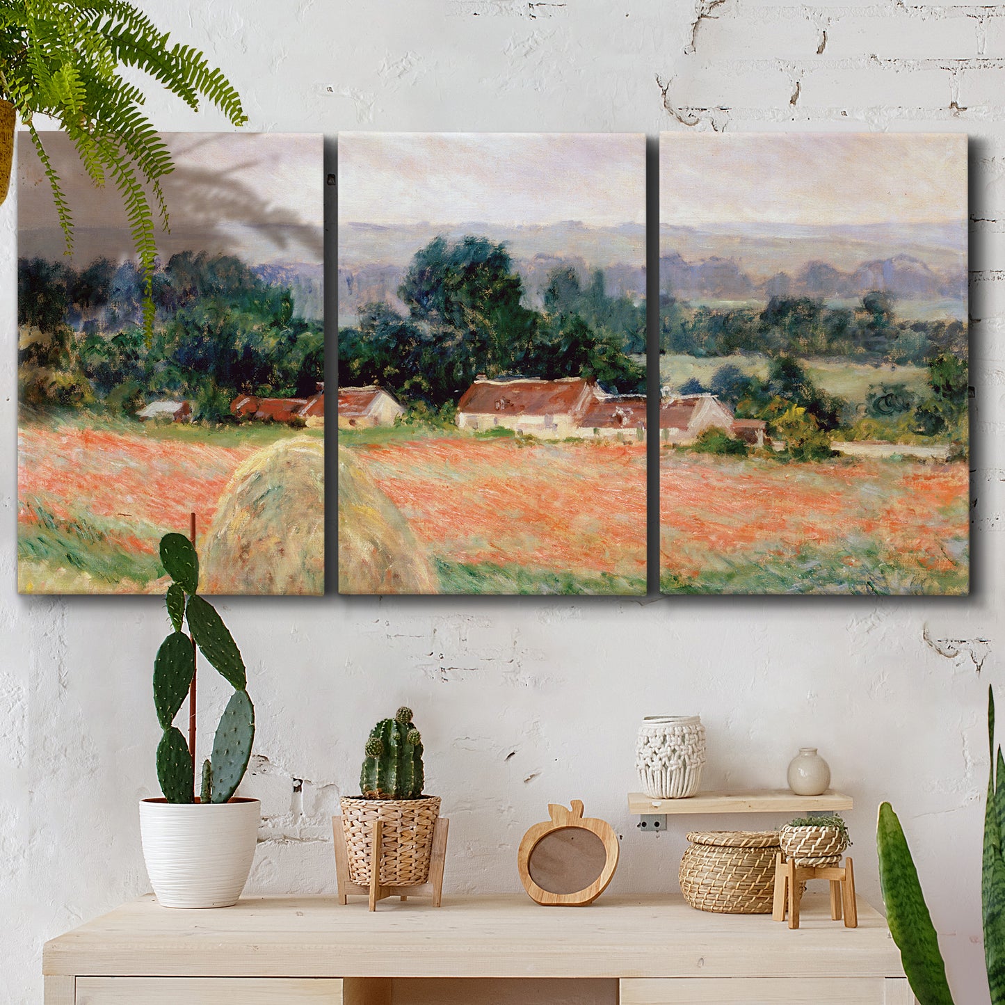 Three-panel canvas wall art featuring haystacks arranged in rural field, displayed in a boho-chic entryway above a console table.