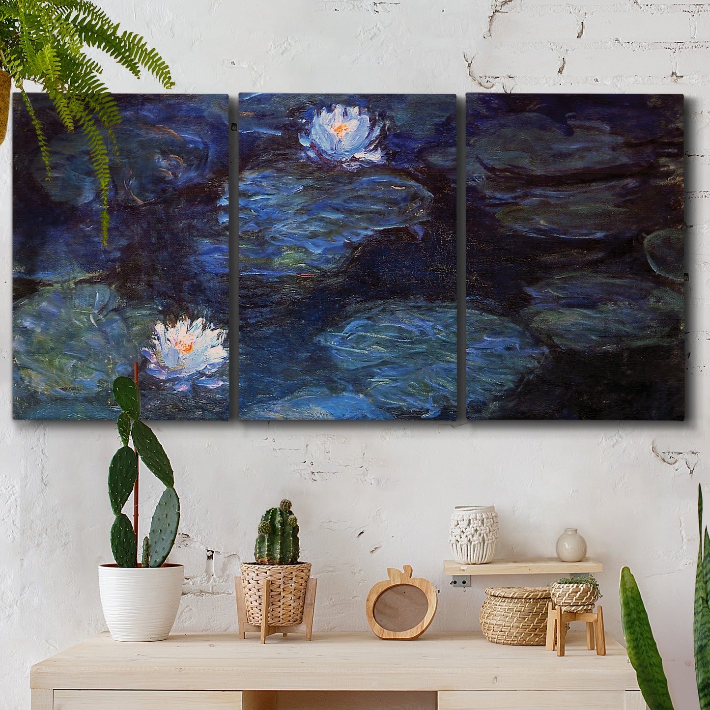 Three-panel canvas wall art featuring deep blue water lily reflections, displayed in a boho-chic entryway above a console table.