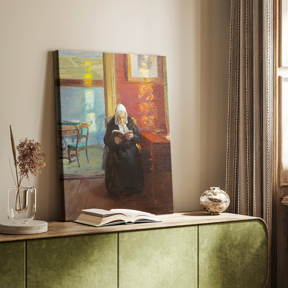 Canvas art print of a quiet scene of a woman reading in a warmly lit interior styled in a home decor setting.
