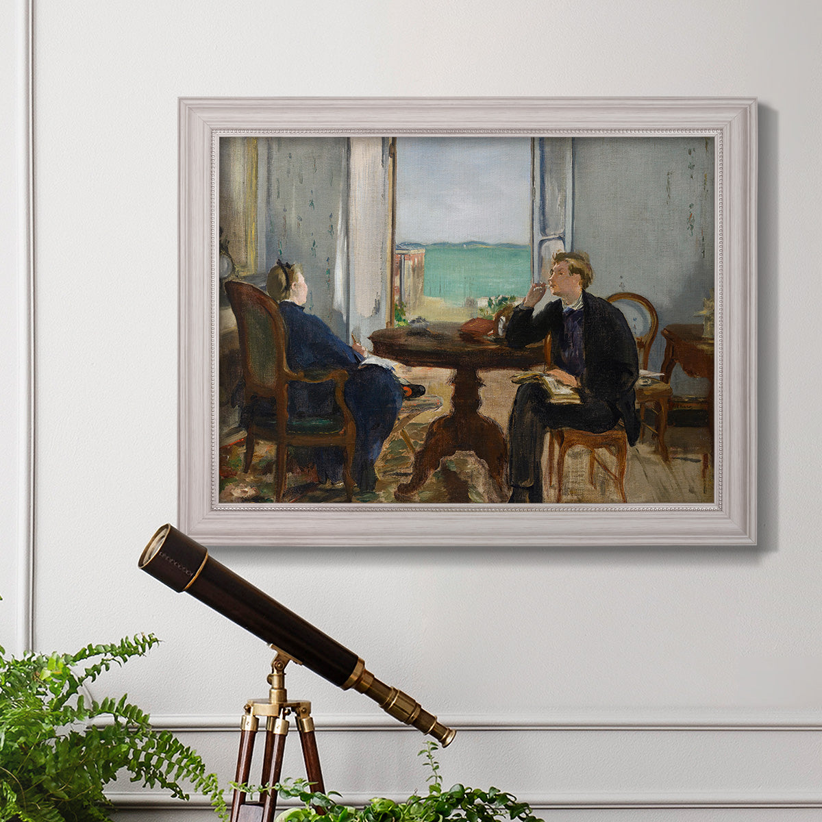 Impressionist interior scene by Édouard Manet in an ornate weathered white frame displayed in a light-toned interior setting.