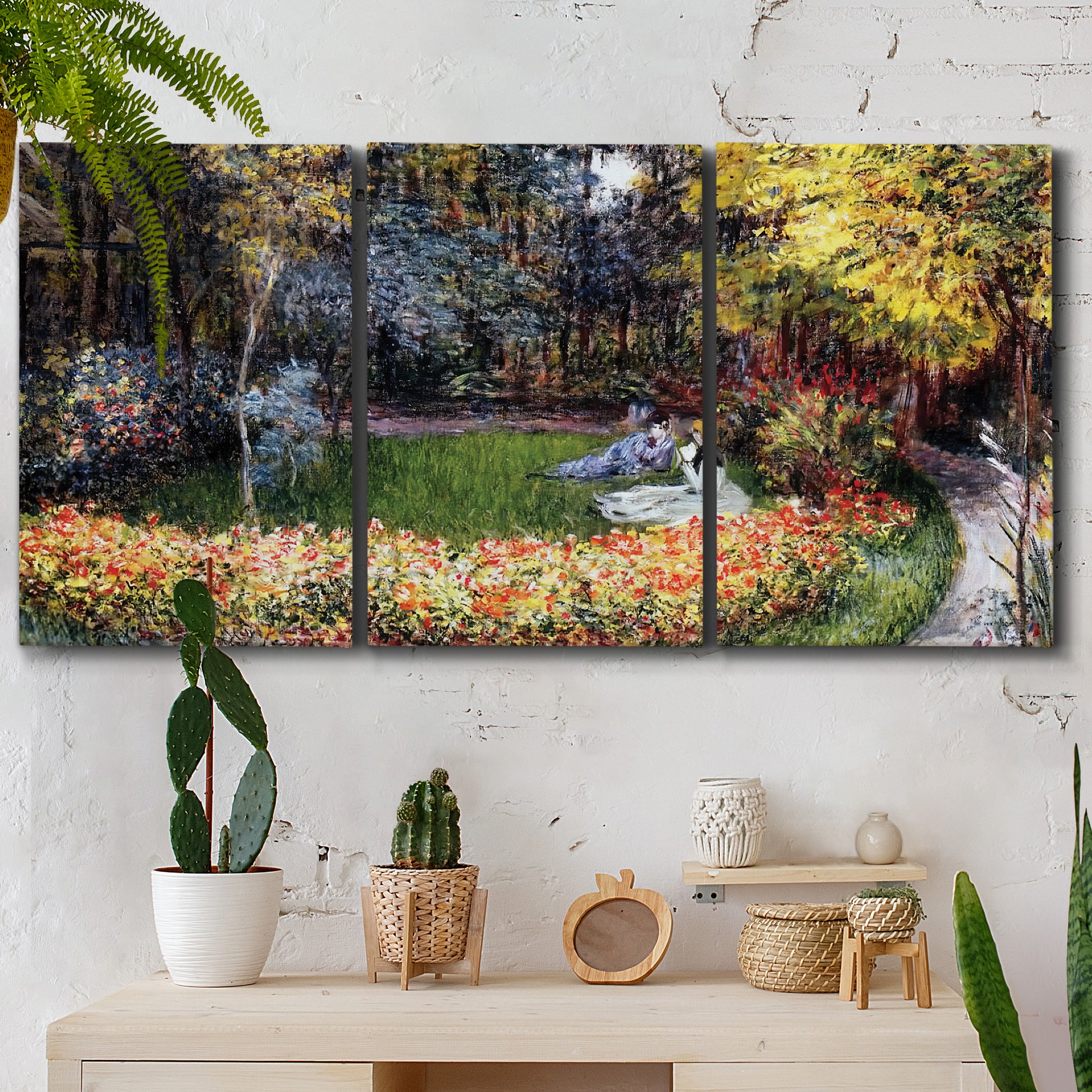 Three-panel canvas wall art featuring garden in full bloom by coast, displayed in a boho-chic entryway above a console table.