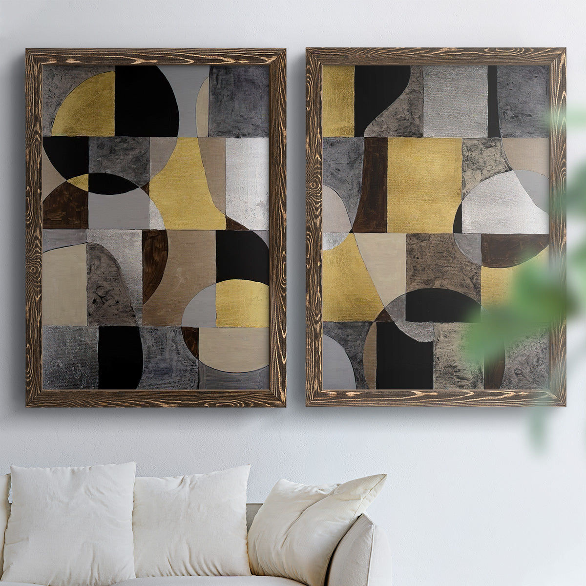 Set of two walnut barnwood framed canvas prints depicting semicircles, rectangles, textured panels, and metallic-looking accents arranged across two complementary compositions above a sofa in a bright living space.