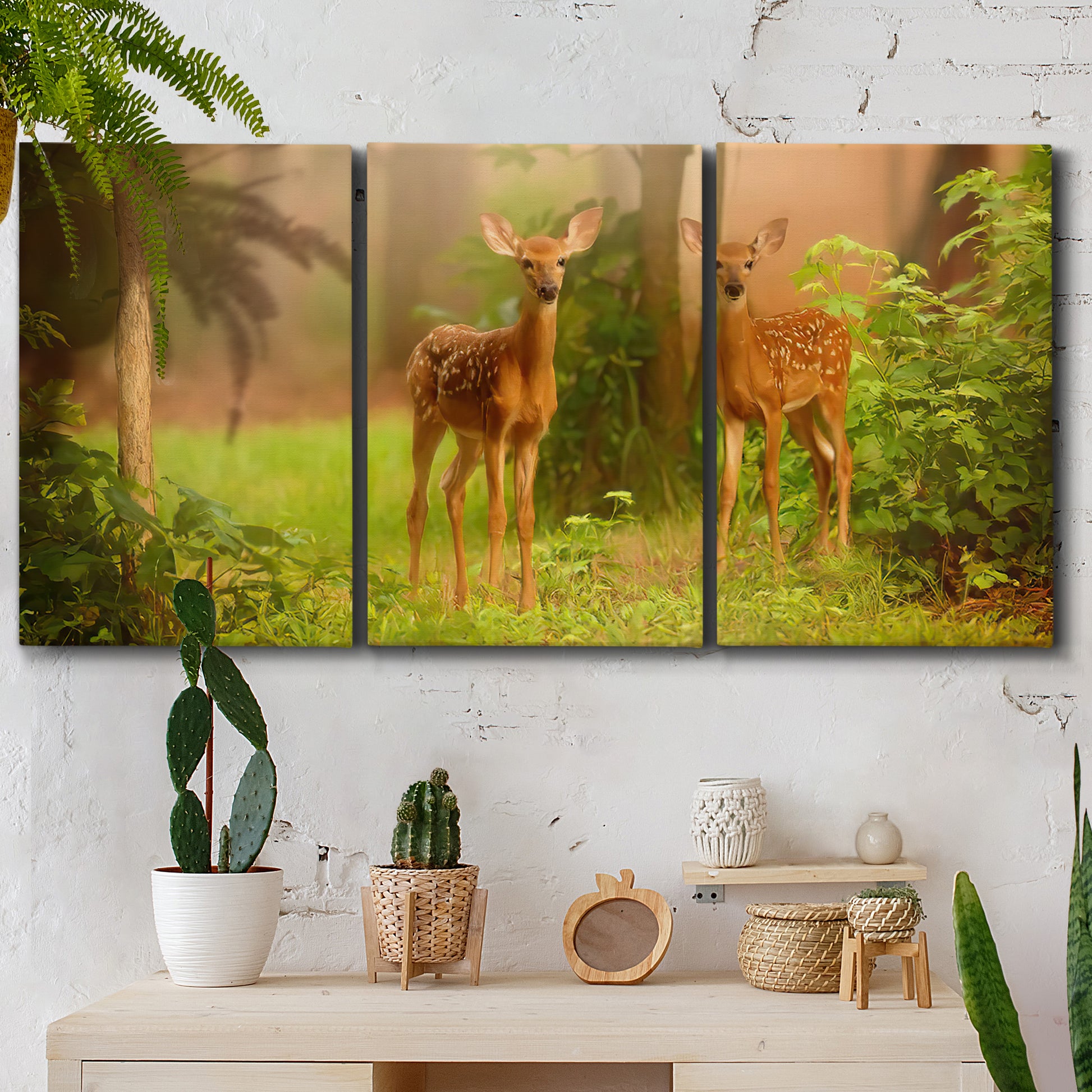 Three-panel canvas wall art featuring resting animals in open field, displayed in a boho-chic entryway above a console table.