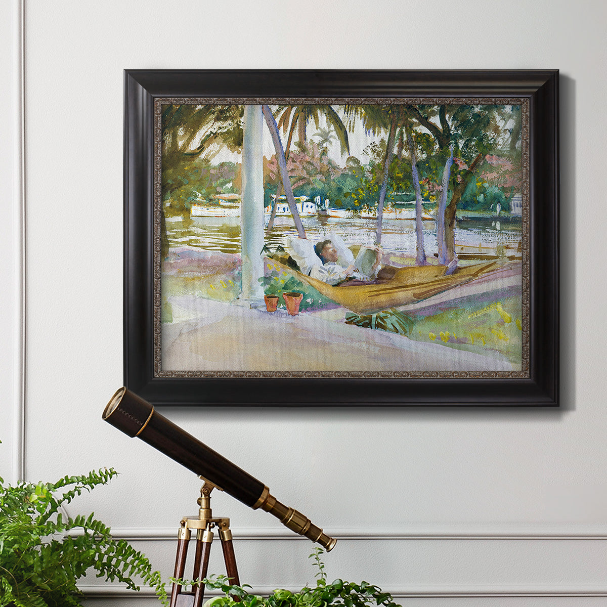 Impressionist leisure portrait scene by John Singer Sargent in an ornate black frame with gilded inner detail displayed in a light-toned interior setting.