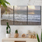 Three-panel canvas wall art featuring calm coastal shoreline seascape, displayed in a boho-chic entryway above a console table.
