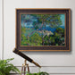 Impressionist Mediterranean coastal landscape by Claude Monet in an ornate bronzed mahogany wood frame displayed in a light-toned interior setting.