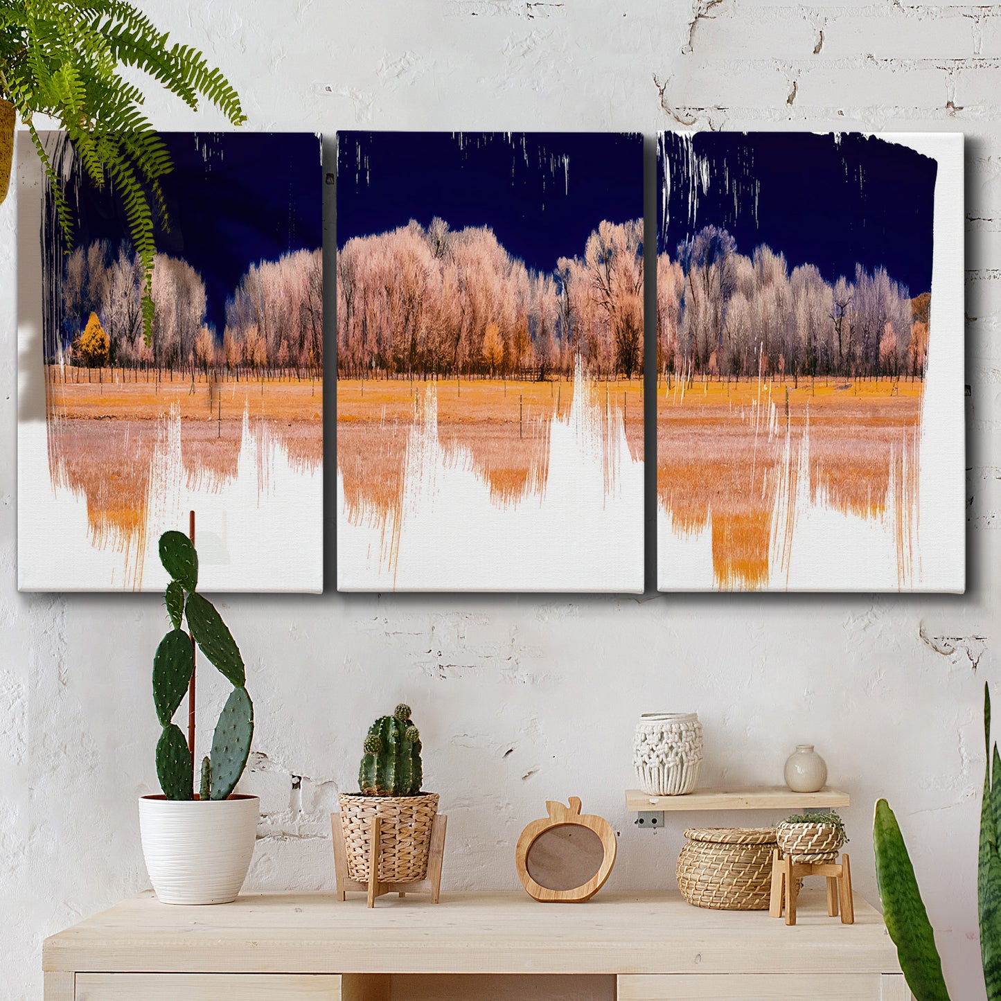 Three-panel canvas wall art featuring panoramic treeline landscape photograph, displayed in a boho-chic entryway above a console table.