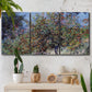 Three-panel canvas wall art featuring orchard of trees in spring bloom, displayed in a boho-chic entryway above a console table.