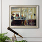 Impressionist café still life scene by Édouard Manet in an ornate champagne frame displayed in a light-toned interior setting.
