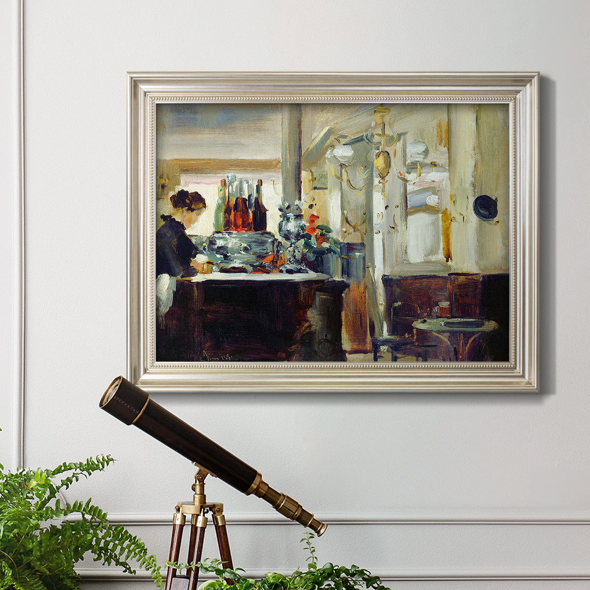 Impressionist café still life scene by Édouard Manet in an ornate champagne frame displayed in a light-toned interior setting.