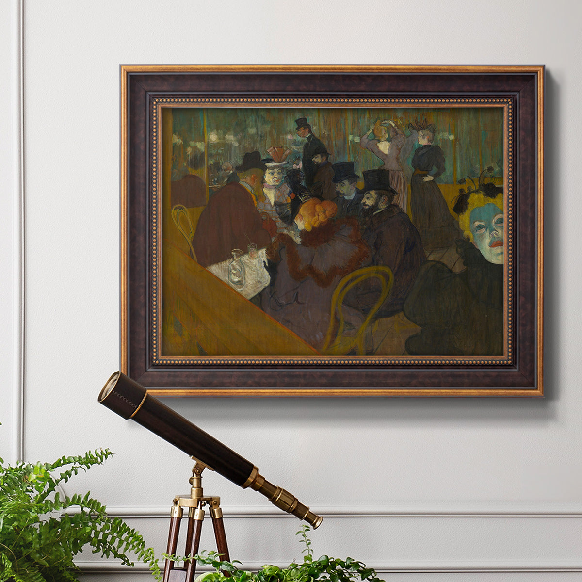 Impressionist cabaret interior scene by Henri de Toulouse-Lautrec in an ornate bronzed mahogany wood frame displayed in a light-toned interior setting.