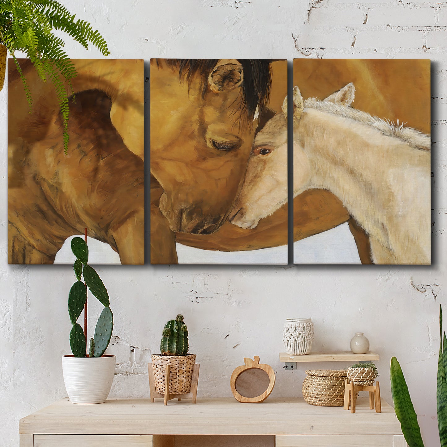 Three-panel canvas wall art featuring gentle horse portrait illustration, displayed in a boho-chic entryway above a console table.