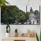 Three-panel canvas wall art featuring chapel building in rural setting, displayed in a boho-chic entryway above a console table.