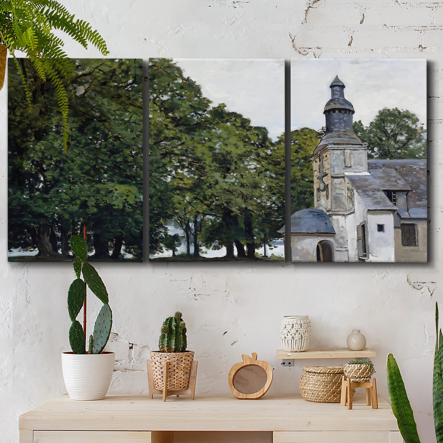 Three-panel canvas wall art featuring chapel building in rural setting, displayed in a boho-chic entryway above a console table.