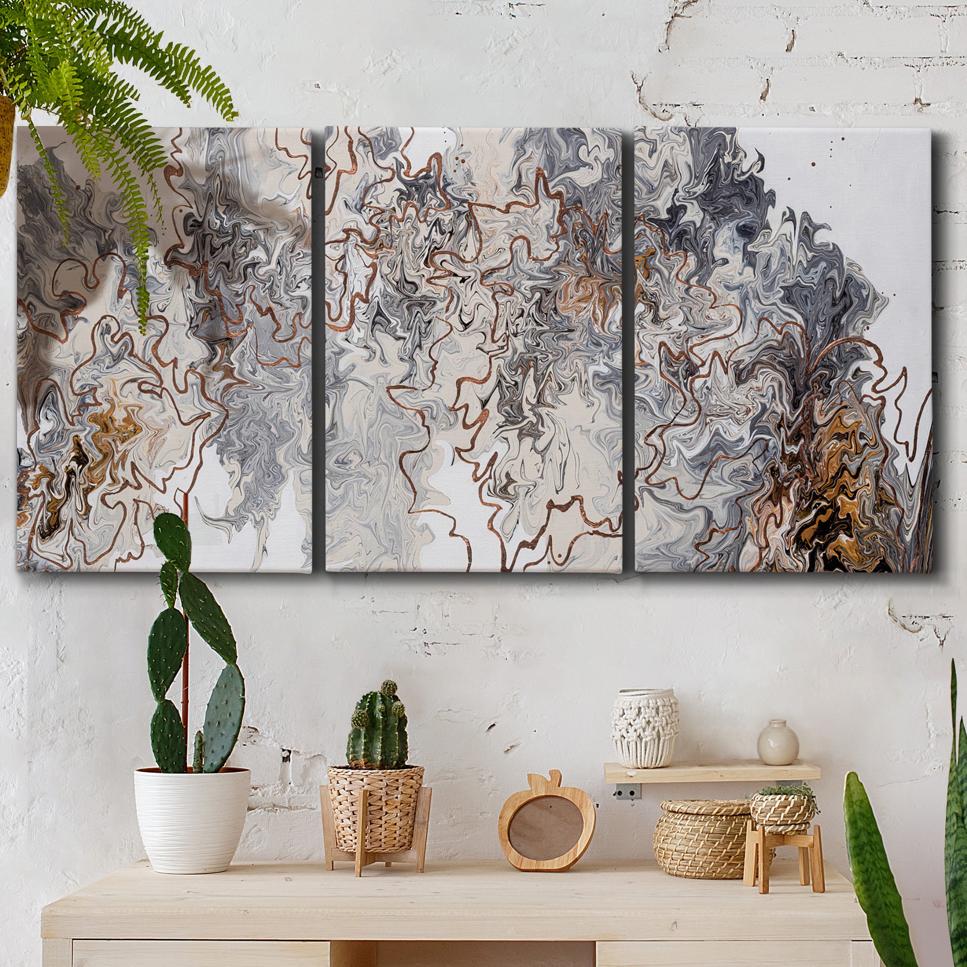 Three-panel canvas wall art featuring wooded trail through forest, displayed in a boho-chic entryway above a console table.