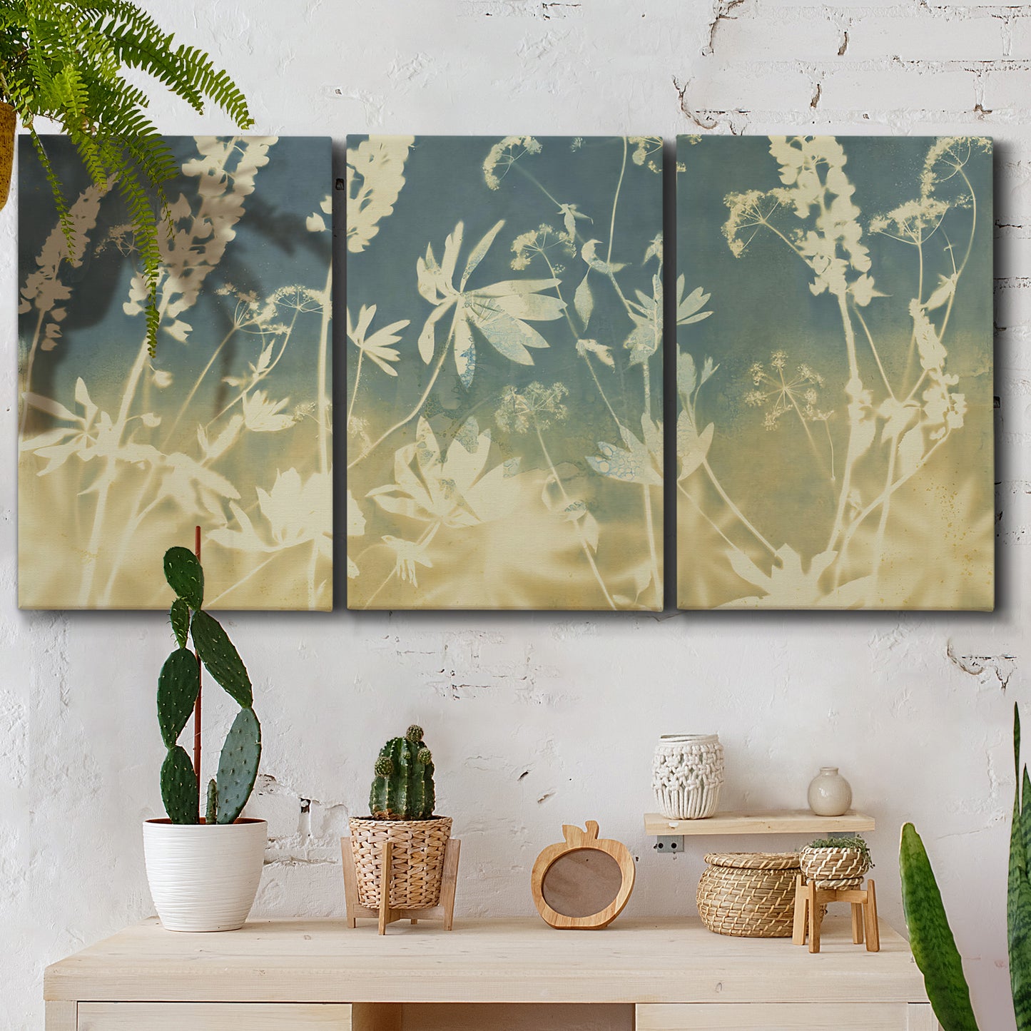 Three-panel canvas wall art featuring lupine flowers in seasonal bloom, displayed in a boho-chic entryway above a console table.