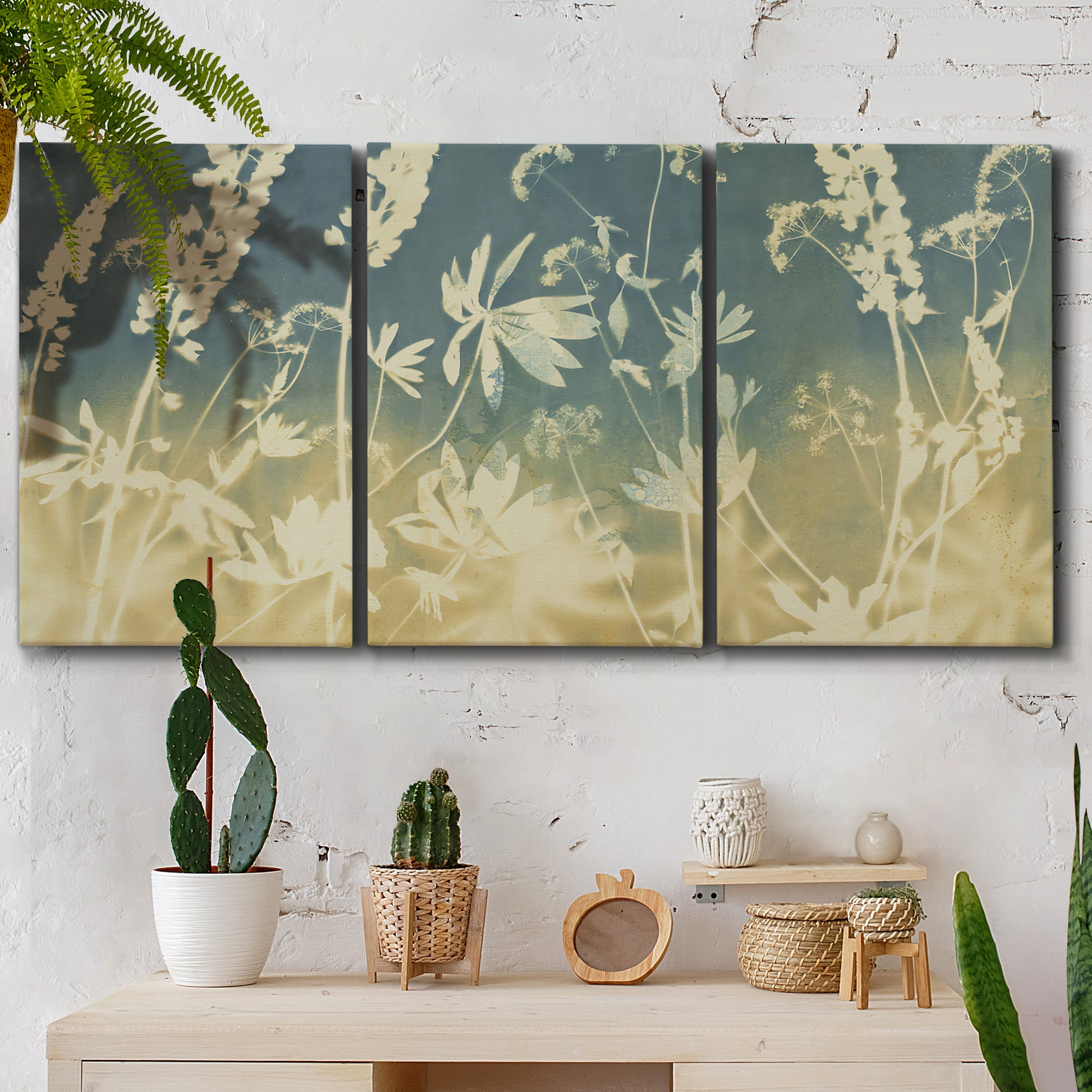 Three-panel canvas wall art featuring lupine flowers in seasonal bloom, displayed in a boho-chic entryway above a console table.