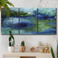 Three-panel canvas wall art featuring flowing blue abstract watercolor, displayed in a boho-chic entryway above a console table.