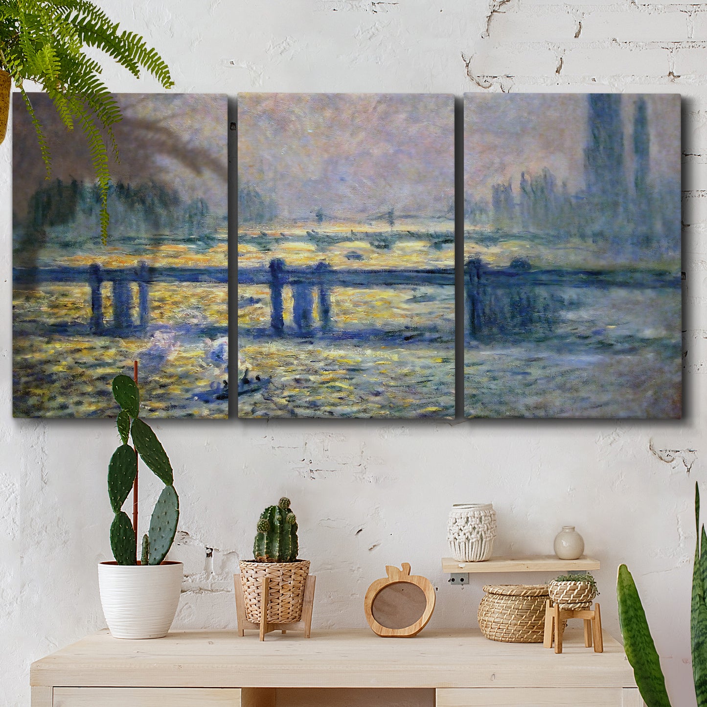 Three-panel canvas wall art featuring london bridge crossing wide river, displayed in a boho-chic entryway above a console table.