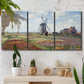 Three-panel canvas wall art featuring tulip fields with windmill, displayed in a boho-chic entryway above a console table.